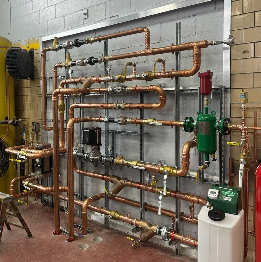 Copper pipes of a mechanical HVAC variable refrigeration piping system installed by Davis Mechanical